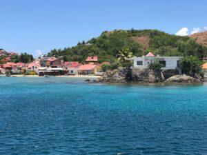 Little houses at les Saintes village with blue transparent waters